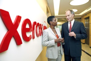 Xerox has made a concerted push toward services as it phases out its traditional document management units, highlighted by the company’s $6.4 billion acquisition of ACS Inc. Xerox CEO Ursula Burns, left, with former ACS CEO Lynn Blodgett.