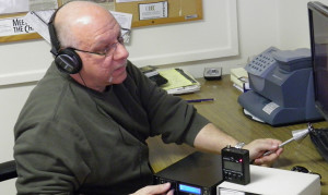 An electric eavesdropping detection machine assists private investigator Leonard Golino.