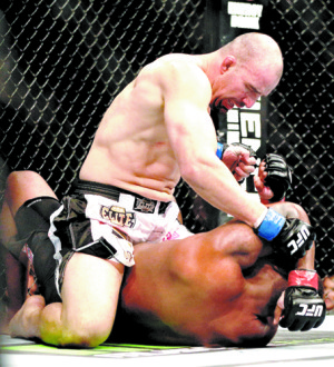 Glover Teixeira (top) fights Quinton “Rampage” Jackson (bottom) during their Jan. 26, 2013, UFC light heavyweight bout at United Center in Chicago. Photo by Josh Hedges/Zuffa LLC, courtesy of UFC. 