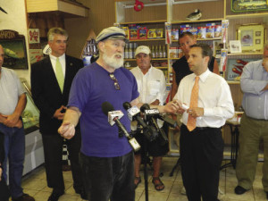 State Rep. Terry Backer discusses a bill aimed at restricting the use of two pesticides found to impact the lobster population at a June 24 press conference in Darien.