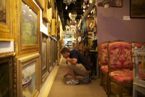 A costumer inspects a drawing at the Connecticut Antiques Center in Stamford.