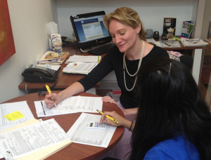 A Women's Business Development Center staff member works with a business owner at one of the center's recent advisory sessions. Photo  courtesy of the WBDC.