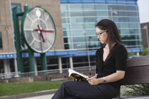 Victoria Gambarbella, a Langone student and consumer researcher for Unilever, reads a book after work on the SUNY Purchase campus while she waits for class to begin.