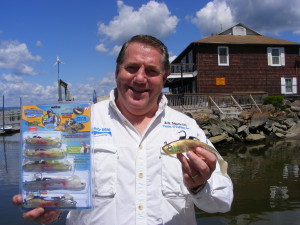 Jeff Mancini displays his company's Mighty Bite fishing lure kit.