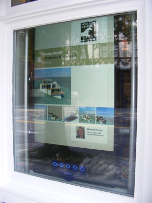 A new touch screen display shows house listings at the Houlihan Lawrence office in Scarsdale.