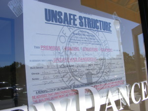 The village placed “Unsafe Structure” signs and caution tape on the stores that received smoke damage from the Aug. 21 electrical fire.