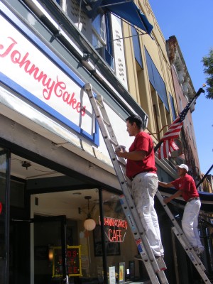 Workers from Spilotras Painting Ltd. tackle the first of 20 Nyack storefronts to get free paint jobs.