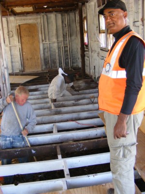 Construction manager Sesh Venkatachari checks his crew's progress in a Breezy Point home being renovated by Habitat for Humanity of Westchester.