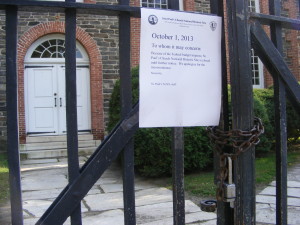 A sign taped to the gates of St. Paul's Church in Mount Vernon.