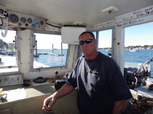 Mike Kalaman aboard the lobster boat Dark Horse in Norwalk Harbor.