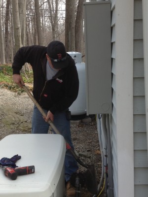 Gault Energy technician Kevin Lago installs a standby generator.