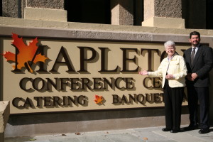 Sister Jane Keegan of the Sisters of the Divine Compassion and Peter Herrero Jr. of Caperberry Events standing in front of Mapleton Conference Center.
