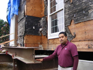 Miguel Palma of Murphy Brothers Contracting at a Rye house being raised to avoid flooding in another storm like Hurricane Sandy.