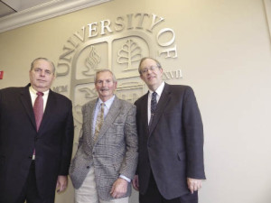 From left: University President Neil Albert Salonen, Ernie Trefz and business school Dean Lloyd G. Gibson.