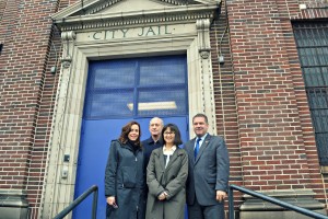 Yonkers Deputy Mayor Susan Gerry, left, and Mayor Mike Spano flank new owners Daniel Wolf and Maya Lin on the steps of the former city jail.