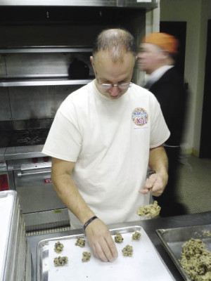 Frank Squeo directs a volunteer cookie baking crew at a BOCES kitchen in West Nyack.