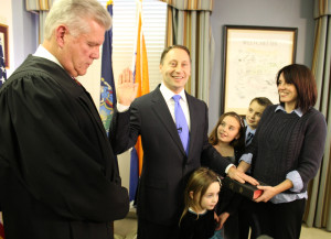 Judge Robert A. Neary (left) administers the oath to Rob Astorino, as his children Ashlin Grace, Kiley Rose and Sean, and his wife Sheila look on. Photo courtesy office of the county executive.