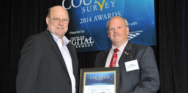 John McCaffrey, right, commissioner of the Westchester County Department of Information Technology, accepts the Digital Counties award from Todd Sander, executive director of the Center for Digital Government, in New Orleans last month. 