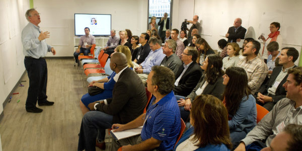 Bryan Mattimore of Growth Engine leads a brainstorming session during the Creativity in the Workplace program at Comradity's Stamford office. Photo by Lindsay Perry