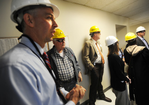 Thomas Copus, plant manager, left, gives a tour of the Harbor Station coal plant. Photo by Brian A. Pounds
