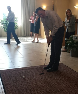 Greg Budnik, assurance leader and partner, putts in McGladrey's Stamford office as part of fundraising efforts.