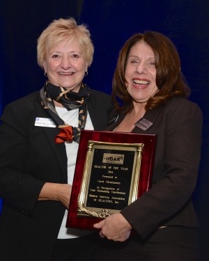 Hudson gateway Association of Realtors president Diane Cummins, left, presents Carol Christiansen with the 2014 Realtor of the Year award.  