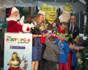 DreamWorks CEO Jeffrey Katzenberg, right, celebrates the opening of the DreamPlace North Pole Adventure with Shrek, Santa Claus and children from the Boys & Girls Club of Northern Westchester.