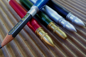 A bullet pencil equipped with a Palomino Blackwing.