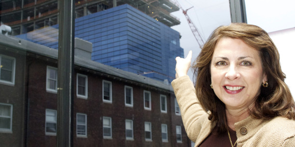 Kathy Silard, executive vice president and chief operating officer at Stamford Hospital, points to the new 11-story hospital expansion project sheathed in thermal glass. 