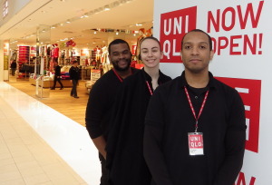 The new Uniqlo store opened in the mall Nov. 7. From left, assistant managers Laron Louis and Dana Sepkovic, and store manager Frederick Tatum. Photo by Bill Fallon