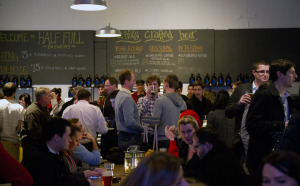 A crowd gathers for drinks and games at Half Full Brewery in February 2013. Photo by Lindsay Perry