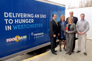 Dedicating the new Food Bank for Westchester truck were, from left, Rick Rakow, Food Bank board chairman; Ellen Lynch, executive director; Kevin Plunkett, deputy Westchester County executive; Sue Norton, PepsiCo vice president of global citizenship; and  Toby Pidgeon, Food Bank director of operations.