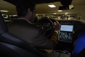 Will Nicholas, northeast regional sales manager for Tesla Motors, shows off the electronic features within the Tesla Model S. Photo by Bob Rozycki