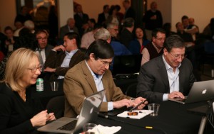 Judges, from left, Janis Collins, co-founder of The Refinery; Mark Schneider, board of directors at New York Angels; and Edward Levene, president of Energy Advantage, cast their votes to select the winner of the pitch competition. Photo by Crystal Kang