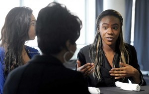 Ana Engelhardt, left, and Milandra Nelson, both 16 and Bethel High School students, participate in a mock job interview conducted by Rhonda Neal, of Guideposts, during a Junior Achievement event held at the Matrix Corporate Center in Danbury. Photo by Carol Kaliff