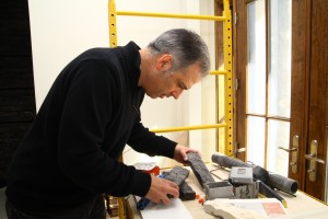 Robert Berger examines the limestone used to build part of his current luxury home project.