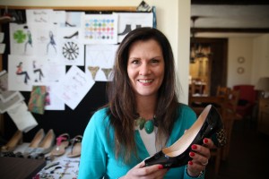 Kara Schwartz holds the prototype of a pump in her Yorktown home office. Photo by Danielle Brody