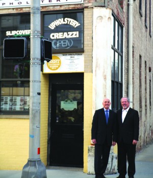 Grow Ossining co-founders Wayne Spector, left, and Dennis Kirby in front of the former Olive Opera House. Photo by John Golden