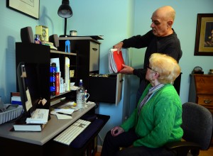 Joe Zorpette brings out the health care file for his wife, Gail, who worked for GE for almost 30 years. Photo by Christian Abraham