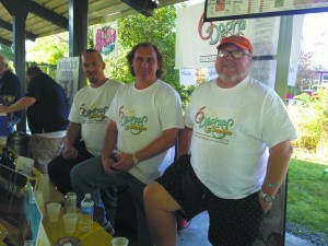 Glenn Sayers, Scott Ryan and Ron McKechnie serve their beers at a Yorktown Rotary Club fundraiser.