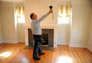 Fairfield resident David Leopold, of Pillar To Post in Stamford, uses an infrared device to detect the cause of a suspected water leak. Photo by Autumn Driscoll