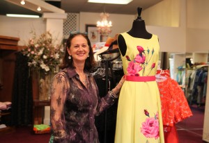 Diane Lloyde Roth stands in L”™Armoire, her clothing and jewelry shop on Park Street. Photo by Danielle Brody