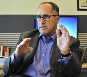 Doug Haynes, president of Point72 Asset Management, talks to reporters in the company's offices in Stamford. Photo by Jason Rearick