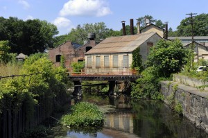 The Norwalk River runs through the old Gilbert & Bennett wire mill in Redding. Town officials are preparing to foreclose on the owner, the Georgetown Land Development Co., for nonpayment of taxes. Photo by Carol Kaliff