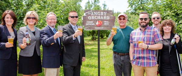 From left, Meghan Taylor, Empire State Development Mid-Hudson regional director; Maureen Halahan, Orange County Partnership president; Richard Ball, commissioner of the state Department of Agriculture and Markets; Orange County Executive Steve Neuhaus; Jeff Crist of Crist Bros. Orchards; Ryan Burk, Angry Orchard cider maker; Bill Fioravanti, OCP”™s director of business attraction and; Lynn Allen Cione, Orange County Chamber of Commerce president.