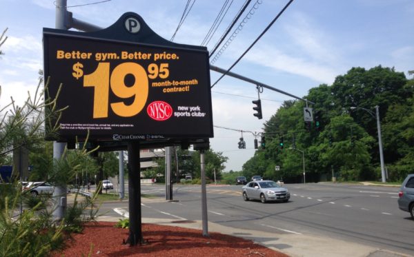 A billboard on Mamaroneck Avenue in White Plains advertising New York Sports Clubs”™ lowered monthly prices. Photo by Evan Fallor