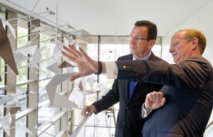 Gov. Dannel Malloy, left, with Ken Siegel, chief administrative officer and general counsel of Starwood Hotels & Resorts Worldwide, in May 2013 in Stamford, where the company announced a headquarters expansion and lease extension. Photo by Lindsay Perry