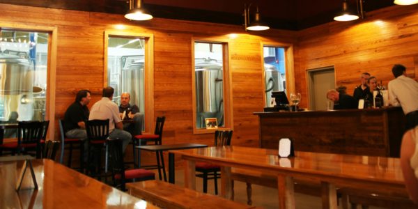 The Veracious Brewing Co. taproom resembles an English pub and offers a view of the brewery through the windows.