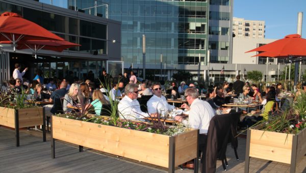 Diners in the outdoor, dockside dining area at Paloma. Photo by Danielle Brody