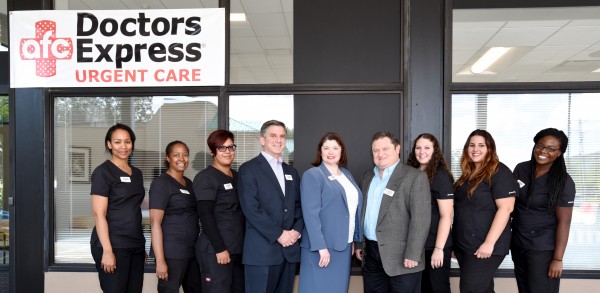 Norwalk Doctors Express Urgent Care employees and principals, from left, Demaris Teel, Karla Norris, Viviana Ortiz, Ken Goldberg, Angela Murphy, Dr. Mark Wasserman, Jill McCanney, Sarah Kopko and Jaren Johnson. Photo by Nancy Hill